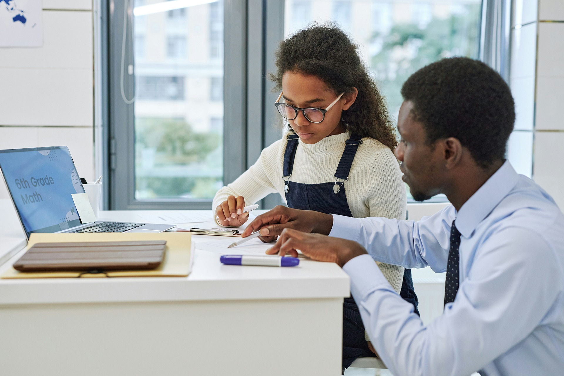 Mentor working one-on-one with a young student